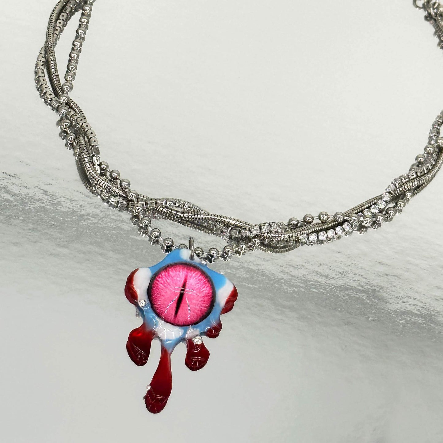 Handmade necklace made of resin with pink eye elements