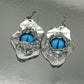 Handmade earrings with blue eye elements made of resin, glass