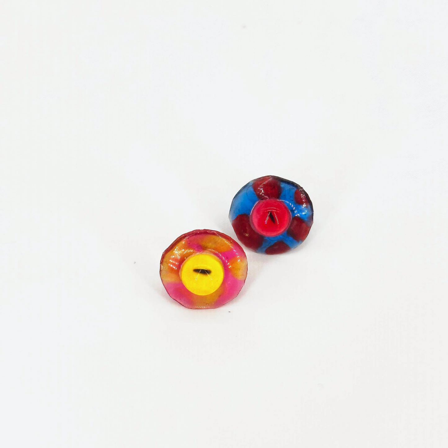 Front view of the handmade ring set with colored eye elements made of resin